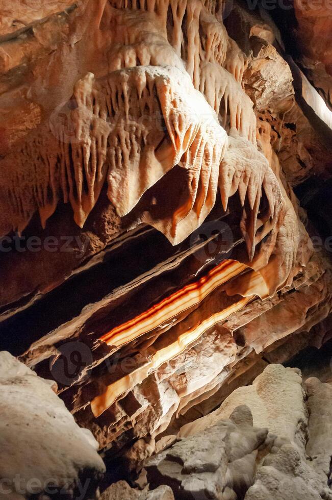 Calcite inlets, stalactites and stalagmites in large underground halls in Carlsbad Caverns NP, New Mexico photo