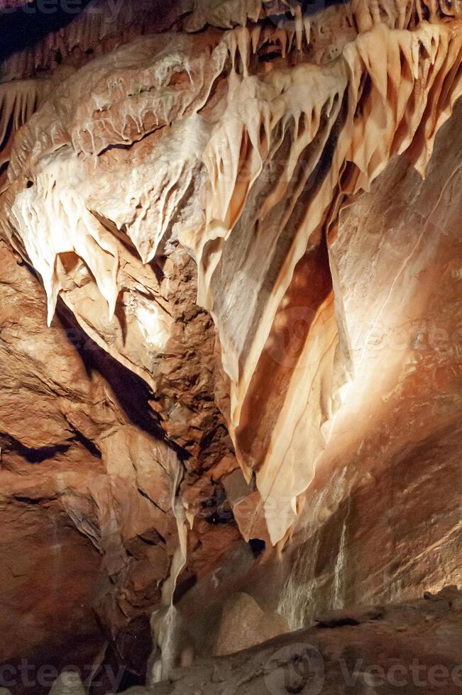 Calcite inlets, stalactites and stalagmites in large underground halls in Carlsbad Caverns NP, New Mexico photo