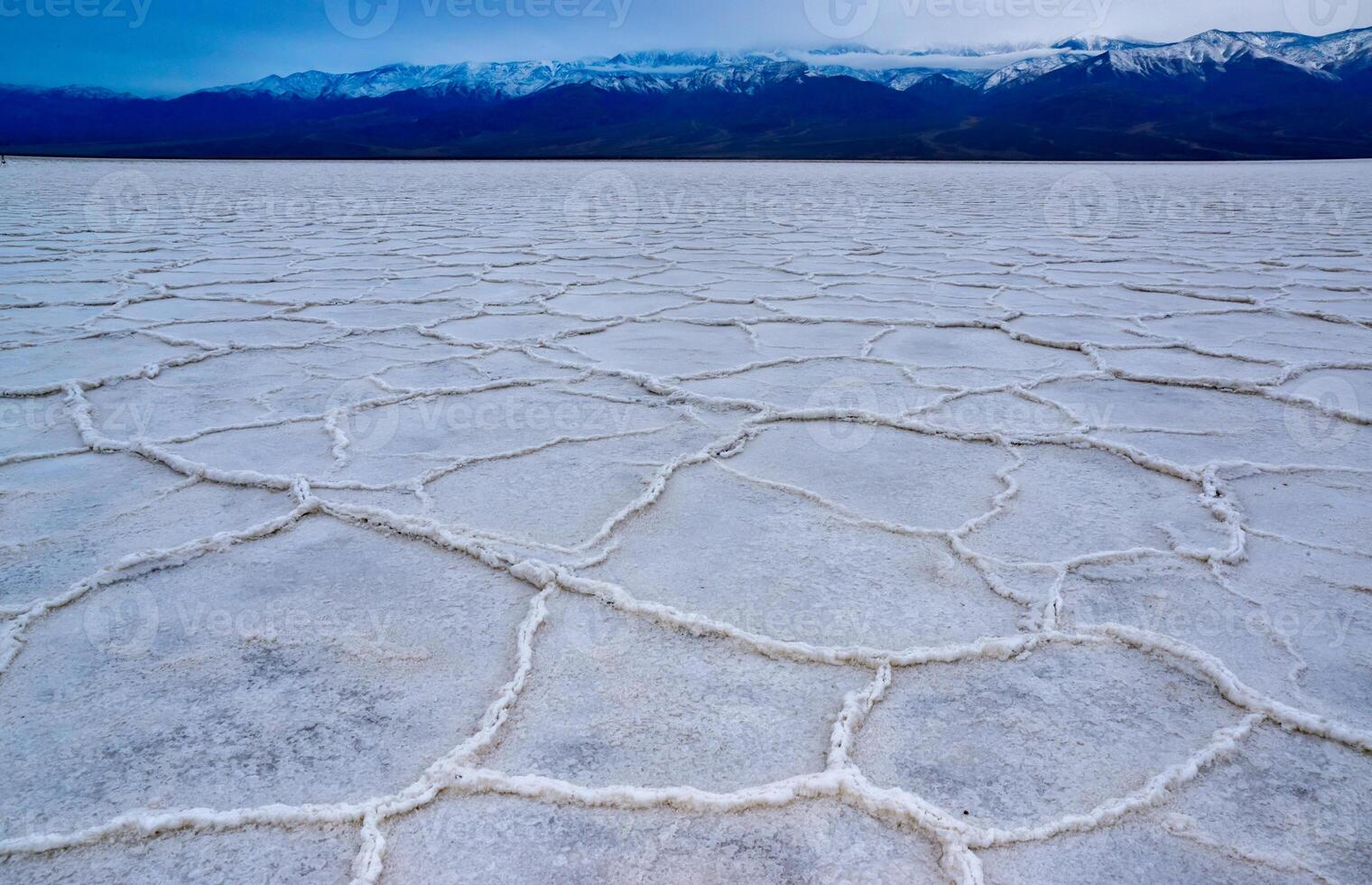 Death Valley National Park, Salt with clay, California. Smooth salt valley with cracked and swollen salt, dead salt landscape photo