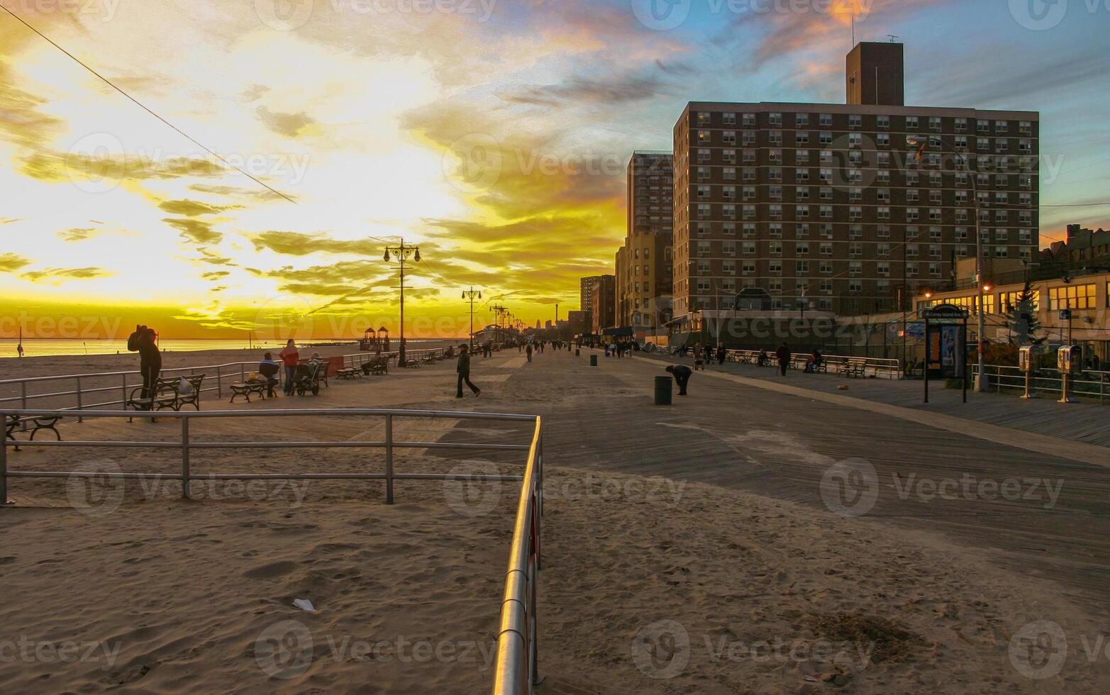 sand-filled pedestrian wooden deck along Brighton Beach, New York USA photo