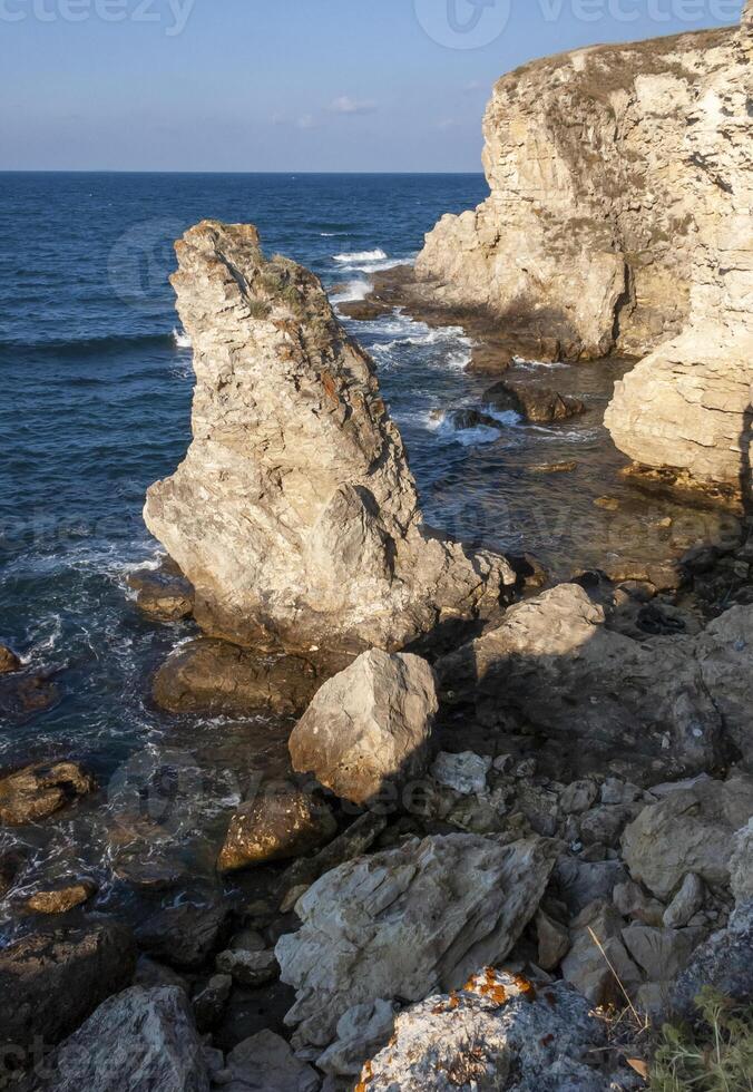 High limestone coastal cliffs against the backdrop of the Black Sea on Tarkhankut, Atlesh, western Crimea photo