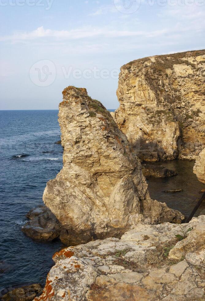 High limestone coastal cliffs against the backdrop of the Black Sea on Tarkhankut, Atlesh, western Crimea photo