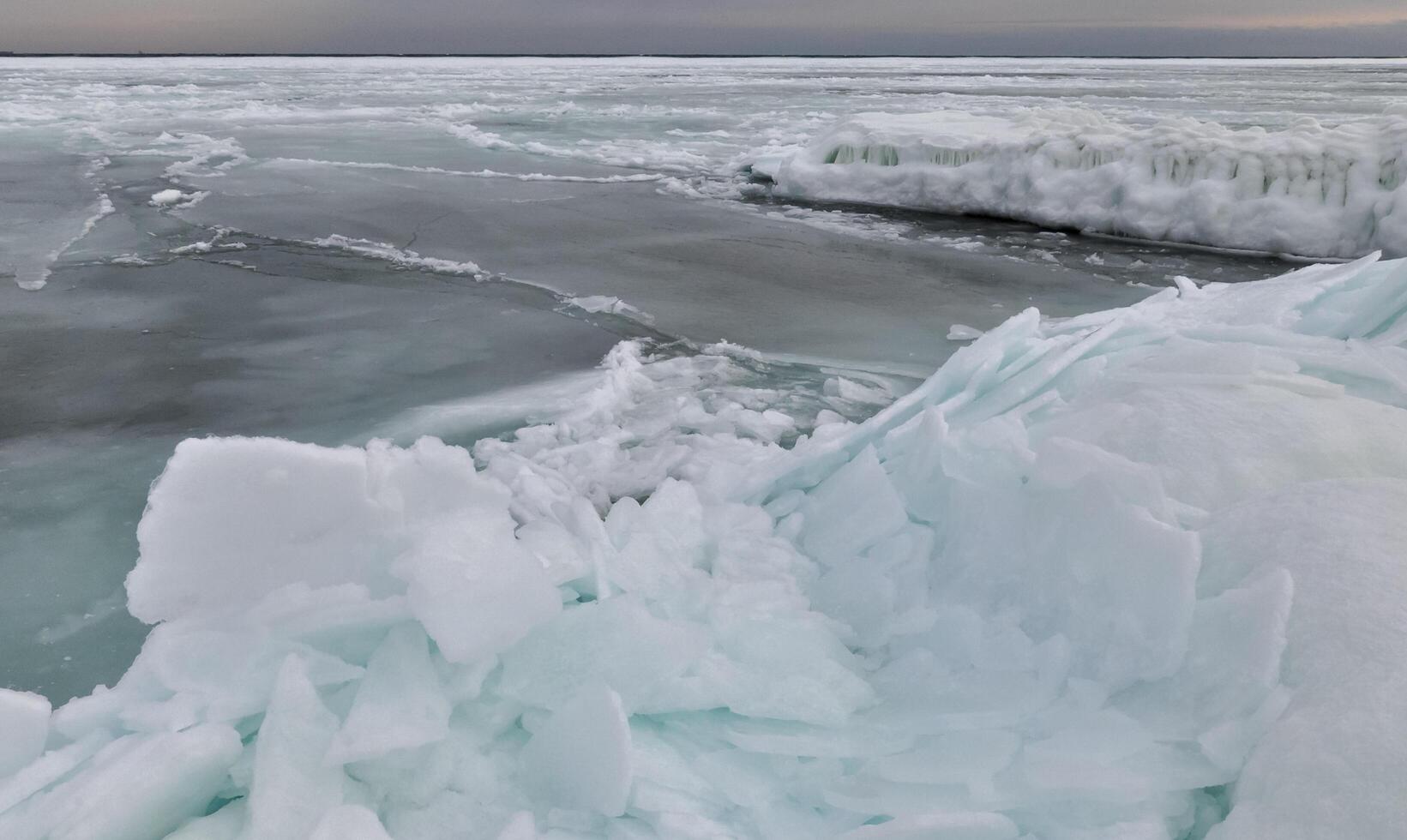 Coastal cliffs and coastal protection structures frozen with ice in the cold winter of 2010, the Black Sea photo