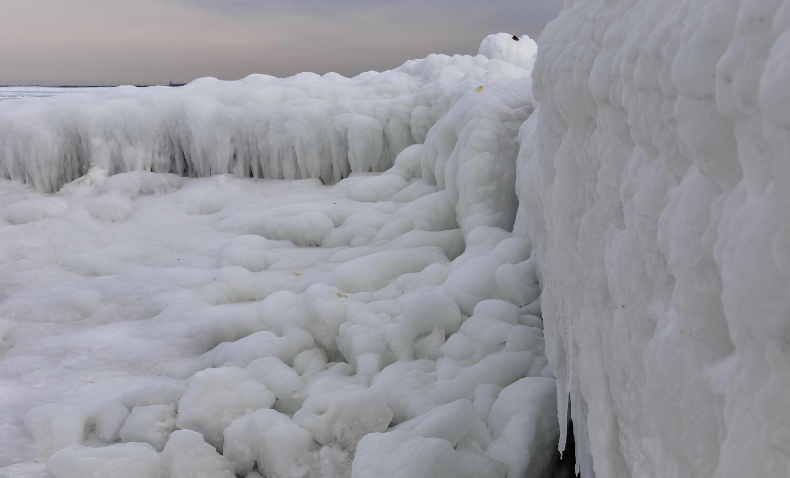 Coastal cliffs and coastal protection structures frozen with ice in the cold winter of 2010, the Black Sea photo