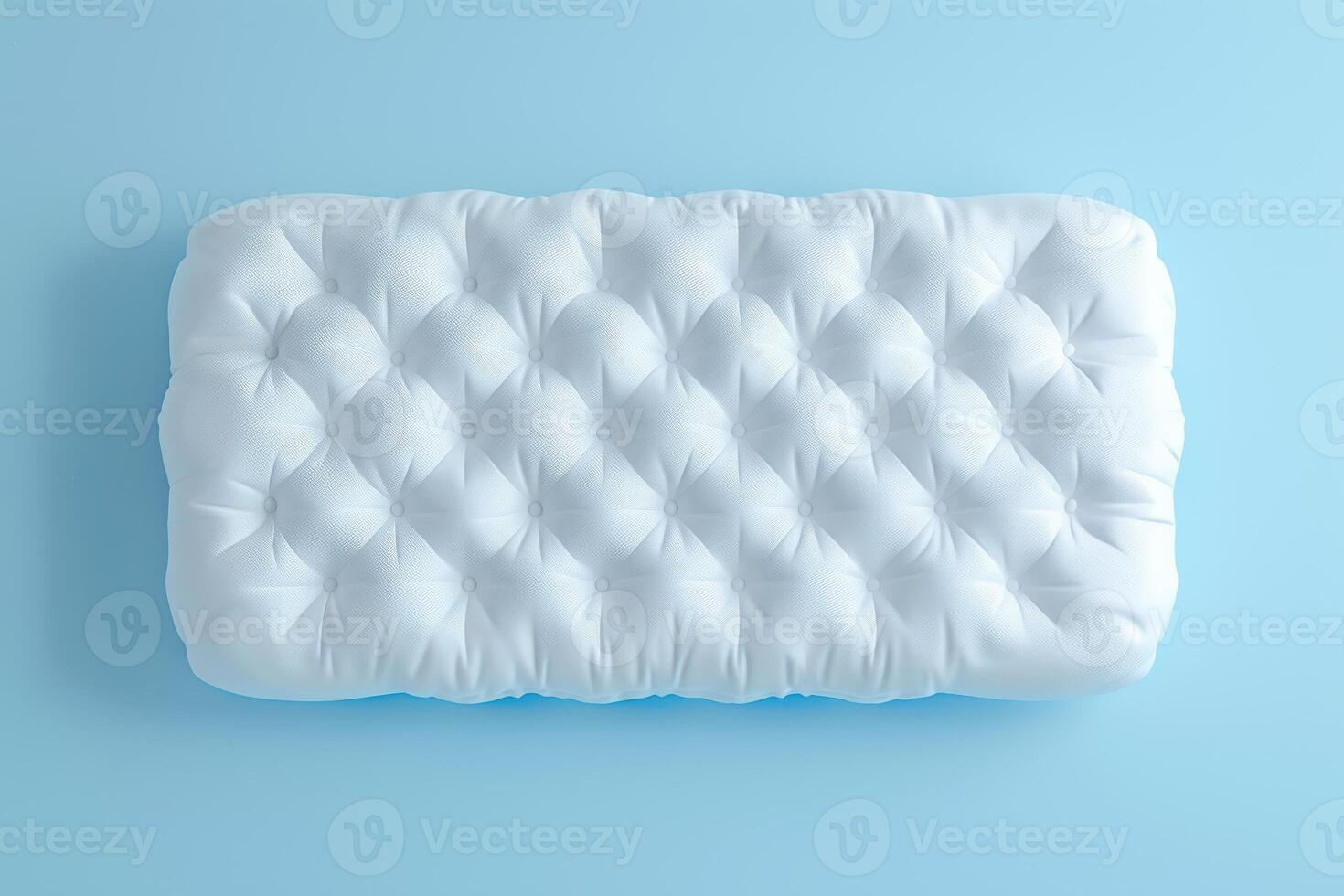 Soft textured white cushion resting on a light blue background, showcasing its inviting design and plush comfort photo