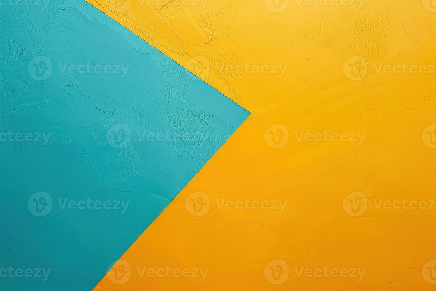 Vibrant geometric abstract of teal and golden yellow textures on a vibrant wall in midday light photo