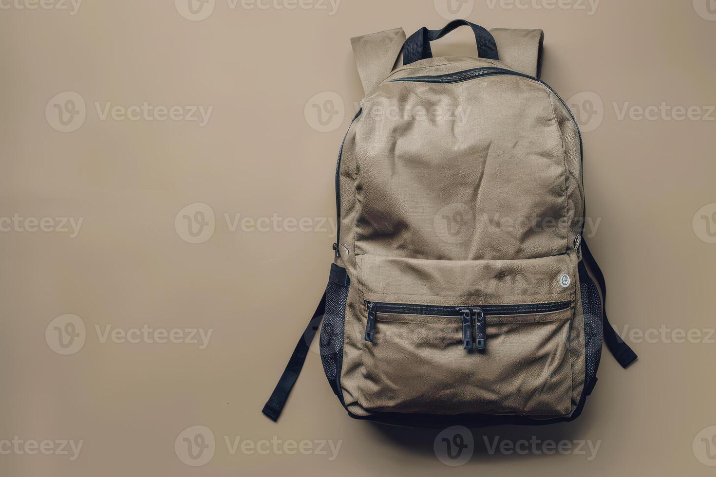 A minimalist backpack resting against a muted background in a cozy indoor setting during the afternoon photo