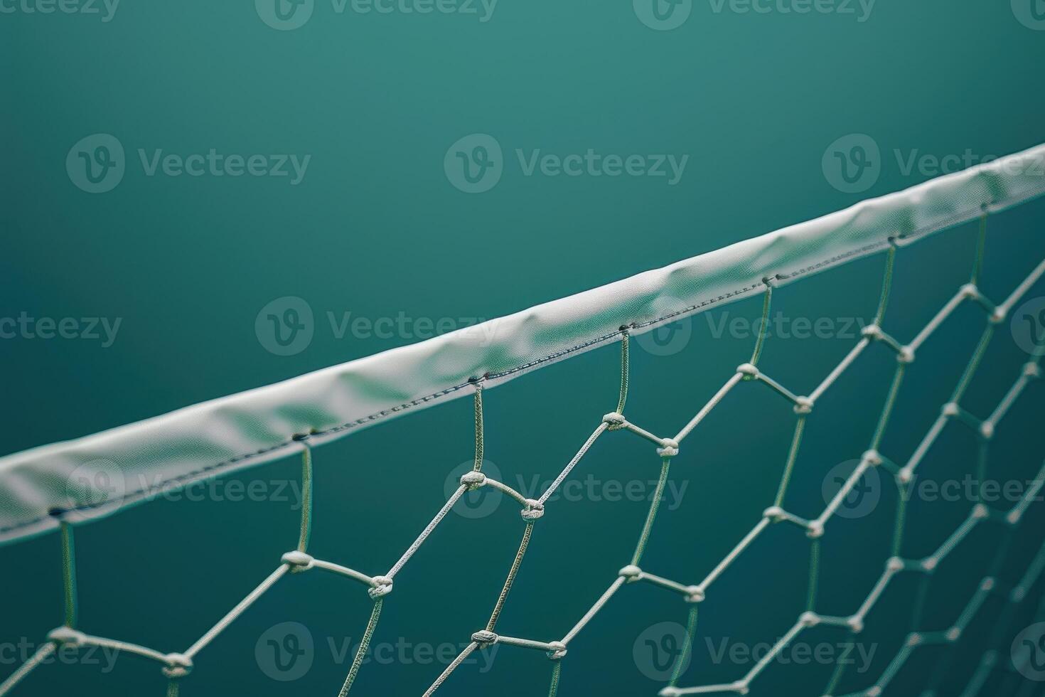 A close-up view of a sports net against a turquoise background with intricate hexagonal patterns and soft lighting photo