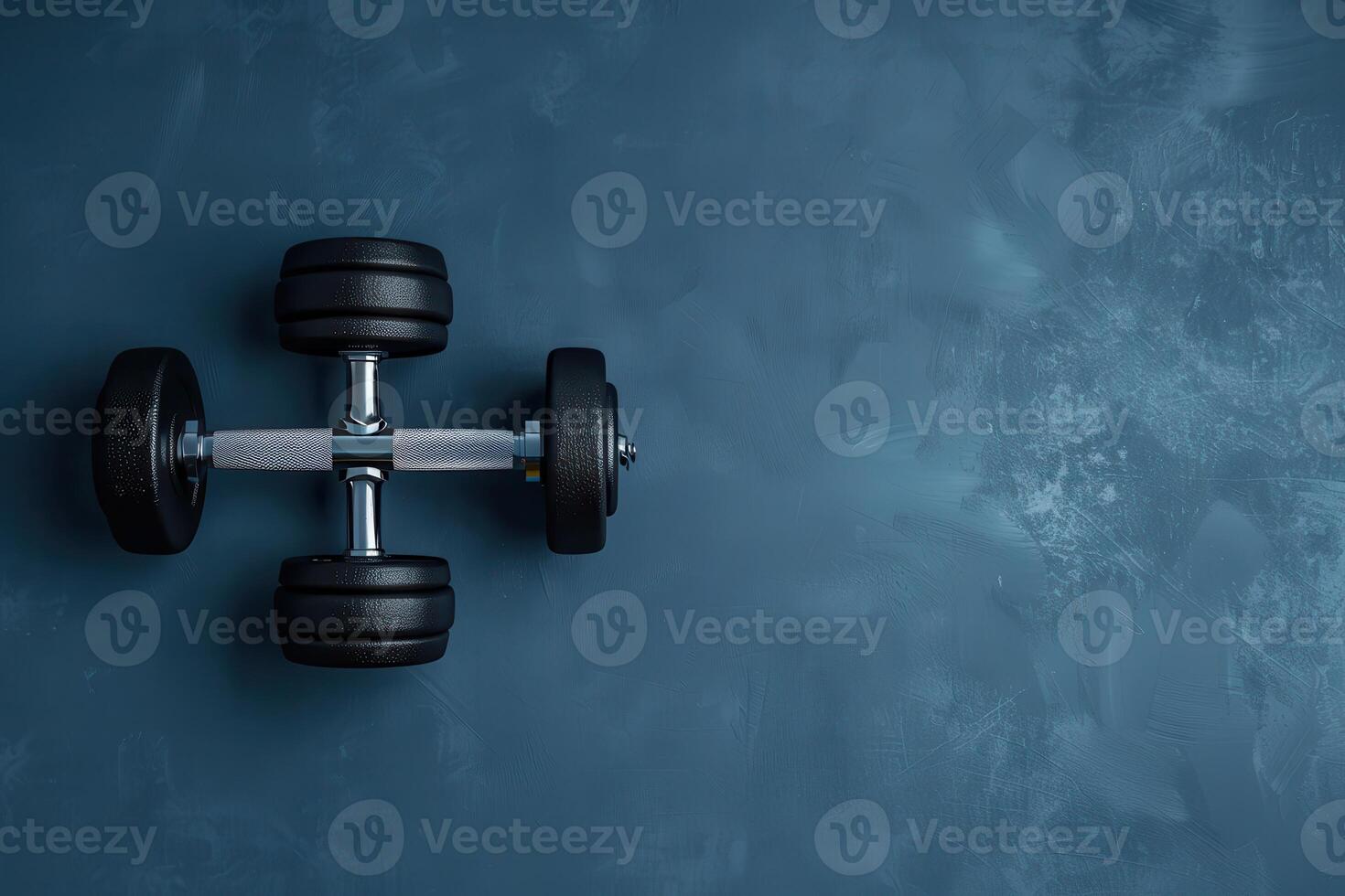 Weights resting on a textured blue surface in a home gym setting during the early morning workout routine photo