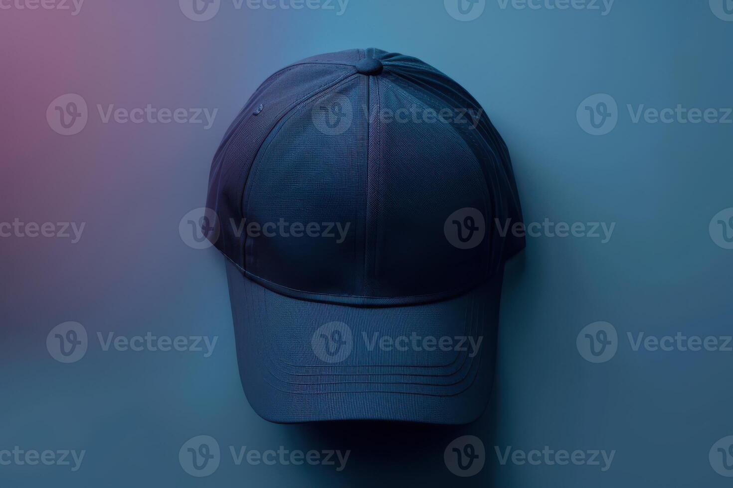 A stylish navy cap resting against a softly illuminated background in a serene blend of blue and pink hues photo