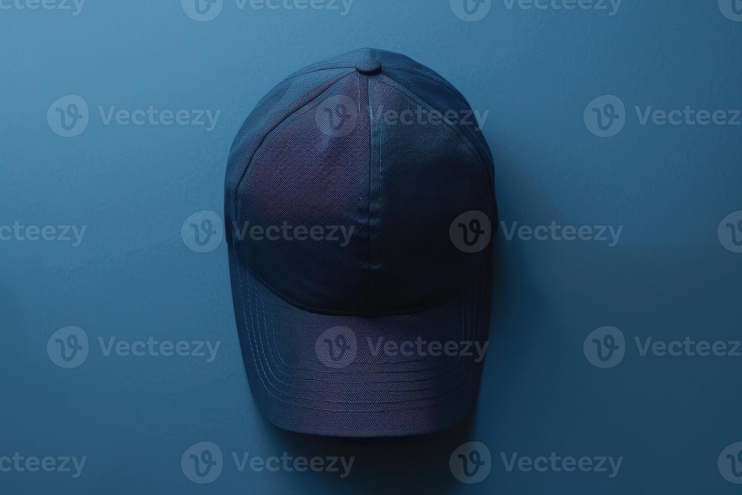 A solitary cap resting against a textured blue backdrop in serene simplicity photo