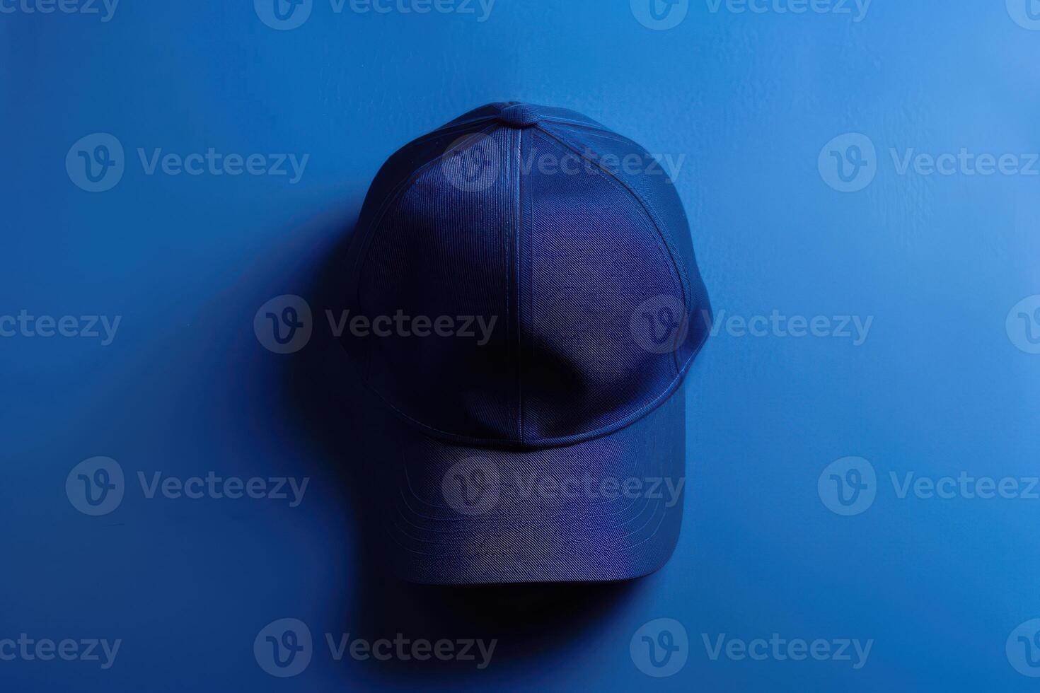 Deep blue cap resting on a vibrant azure background, capturing a moment of tranquility and style in soft light photo