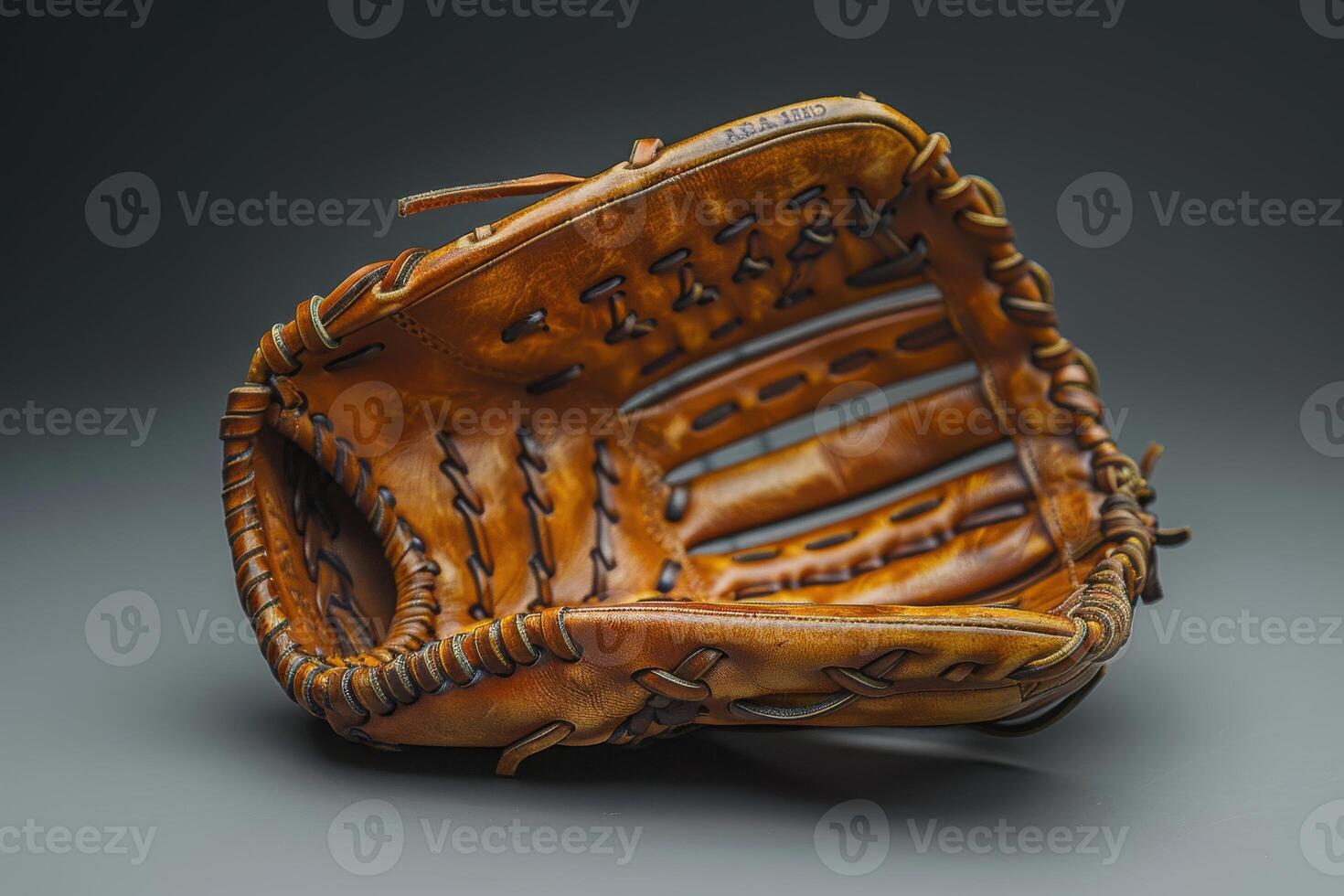 A well-worn baseball glove resting on a dark surface, capturing the essence of the game and memories it holds photo