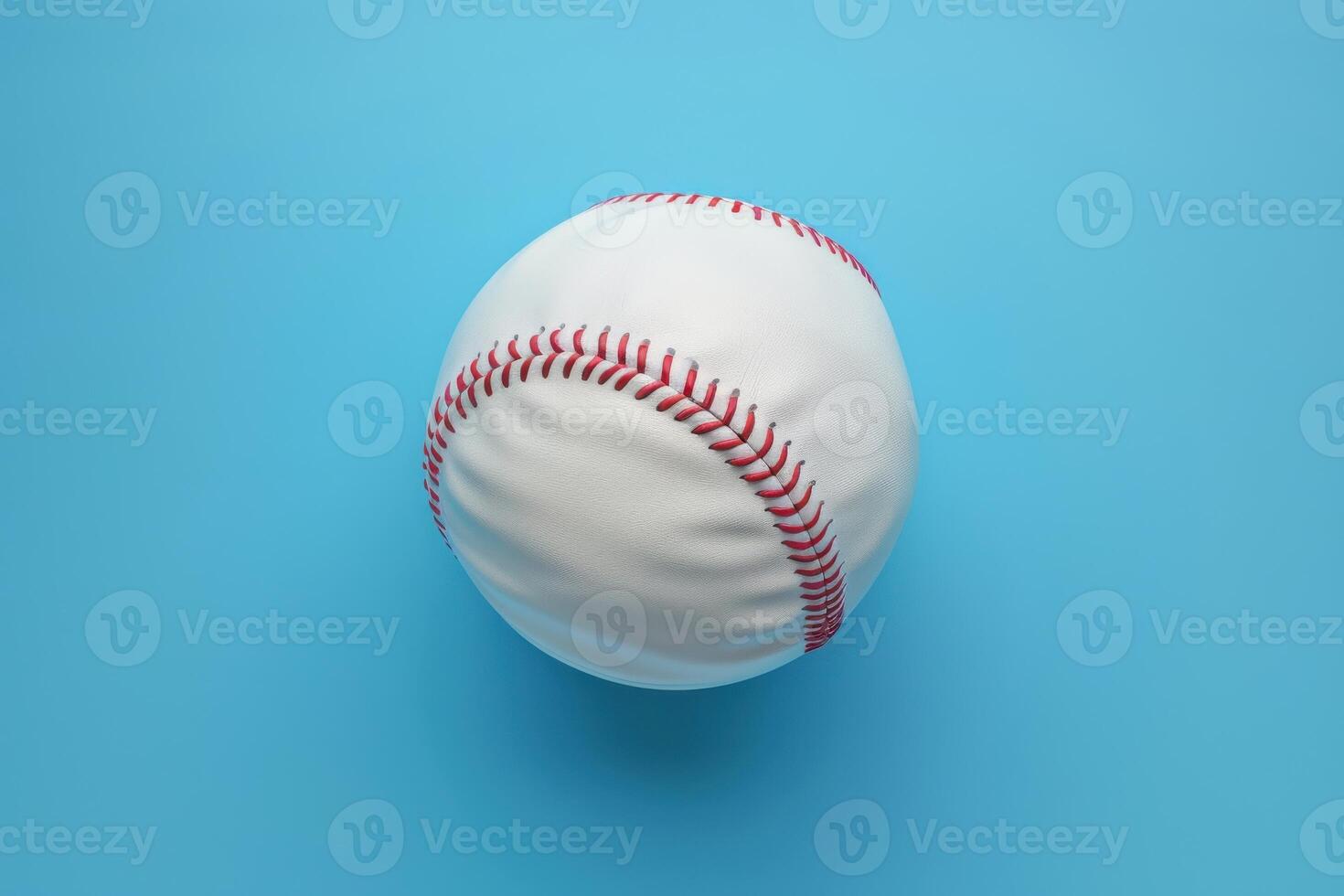 A classic baseball resting against a vibrant blue background, ready for the next pitch on a sunny day at the ballpark photo