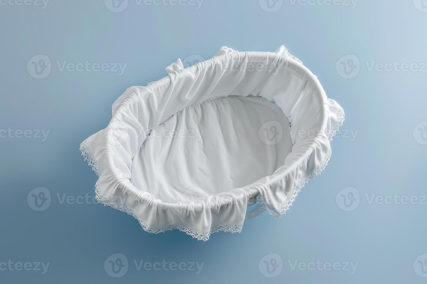 Soft white bassinet resting on a tranquil blue surface, gently inviting a peaceful slumber for a newborn at twilight photo