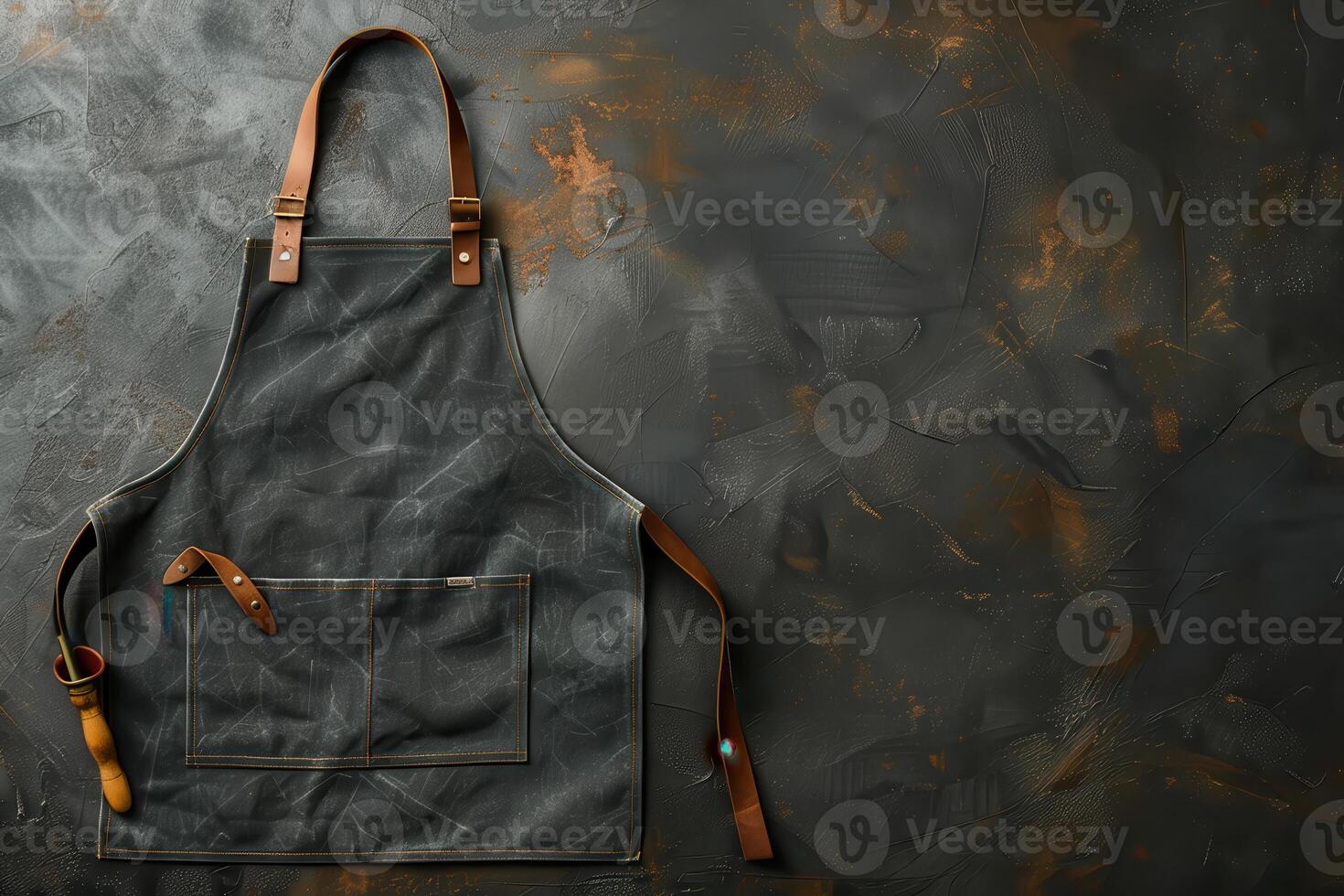 A vintage artisan's apron draped against a rustic, textured background in warm, earthy tones photo