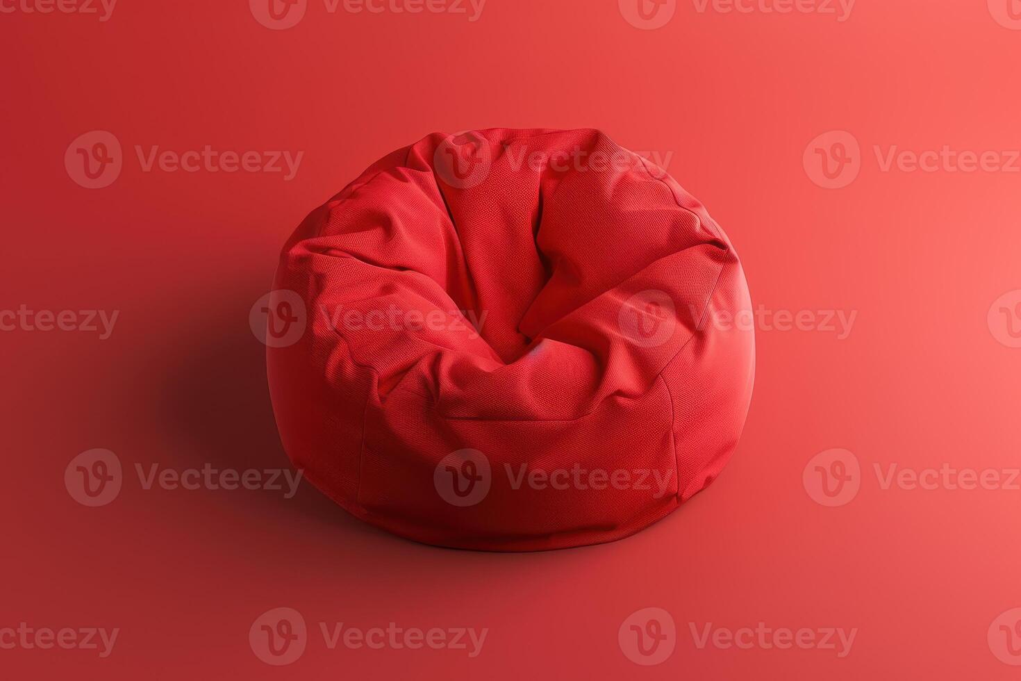 A vibrant red bean bag chair inviting relaxation against a complementary background photo