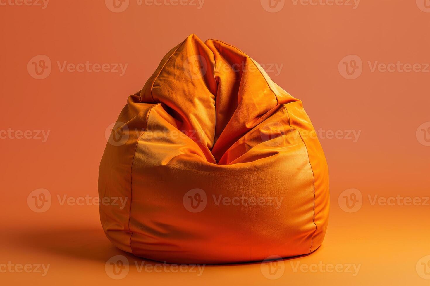 Cozy orange bean bag chair on warm-toned background creating a relaxed atmosphere photo