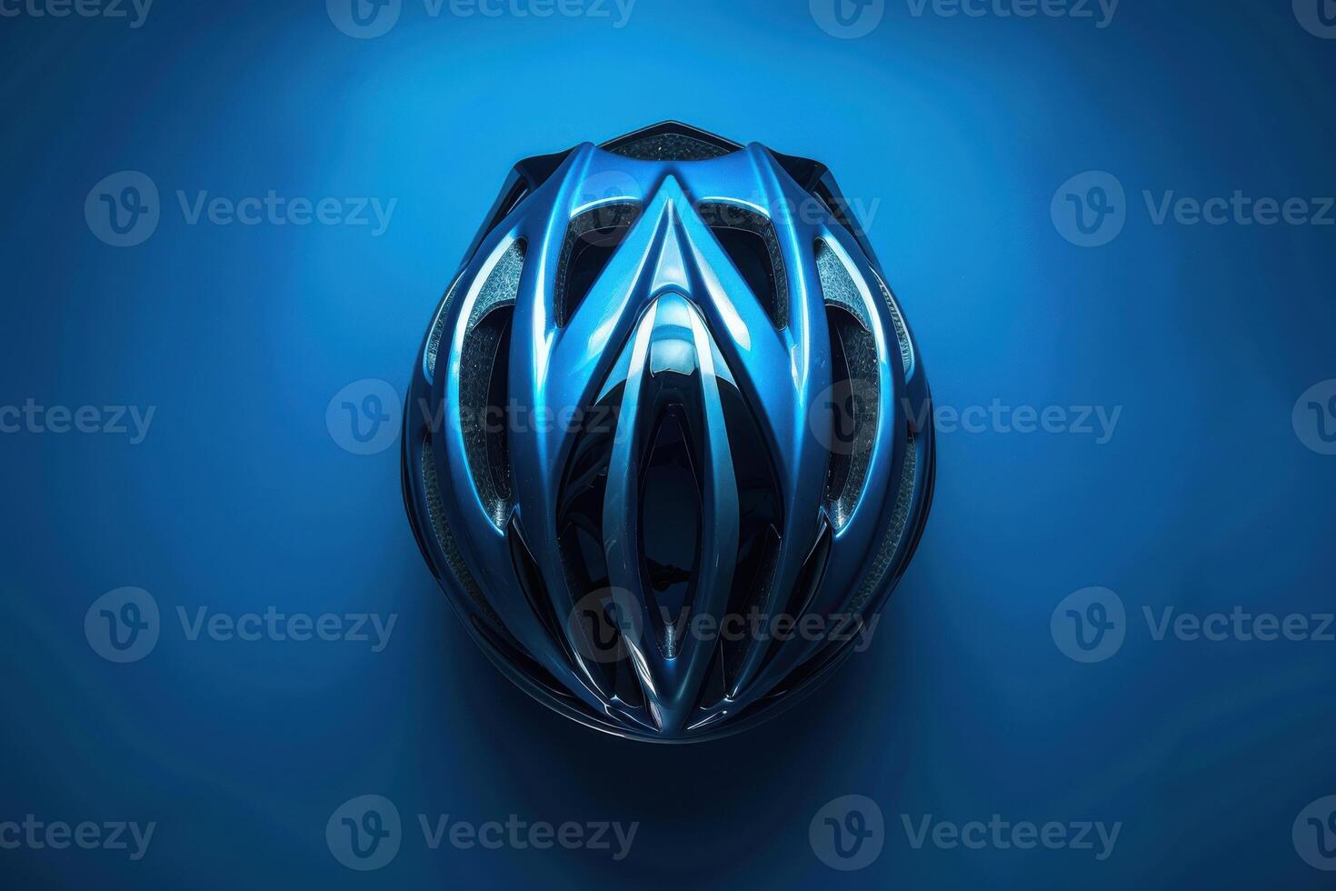 A sleek blue bicycle helmet against a vibrant blue backdrop, showcasing safety gear design and craftsmanship photo