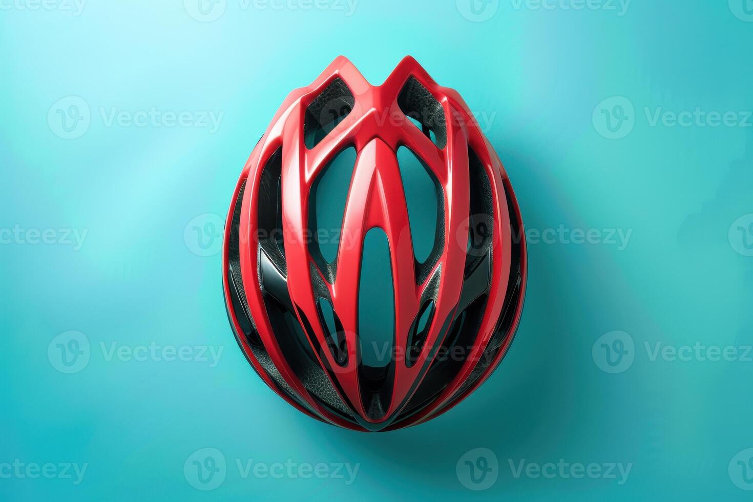 A sleek red cycling helmet on a bright turquoise background, highlighting its aerodynamic design and safety features photo