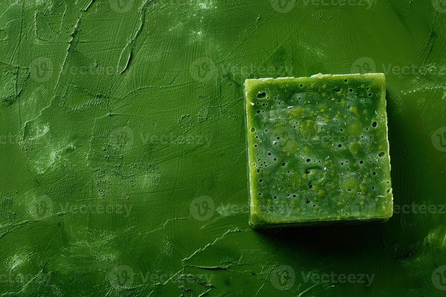 Elegant green soap resting on a textured surface, capturing the essence of nature's purity and craftsmanship photo
