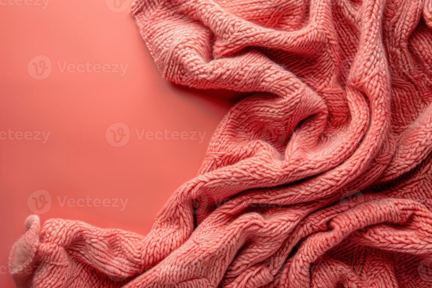 Cozy morning vibes featuring a soft coral blanket on a textured pink background in a warm, inviting setting photo