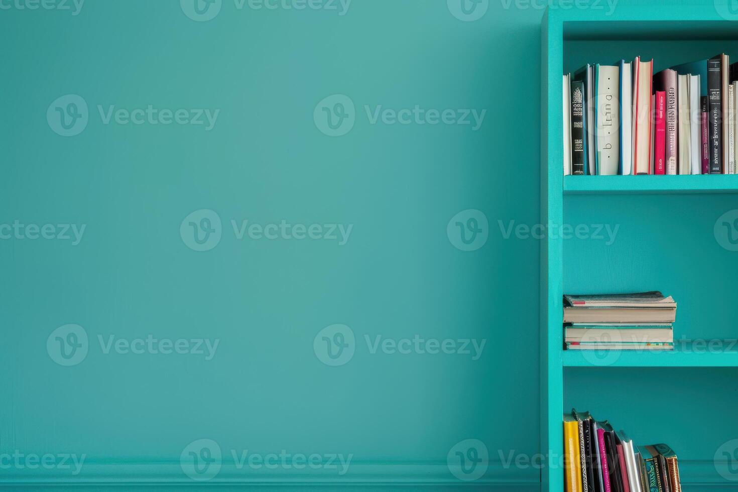 A vibrant turquoise wall enhances a stylish bookshelf filled with an array of colorful books in a modern living space photo