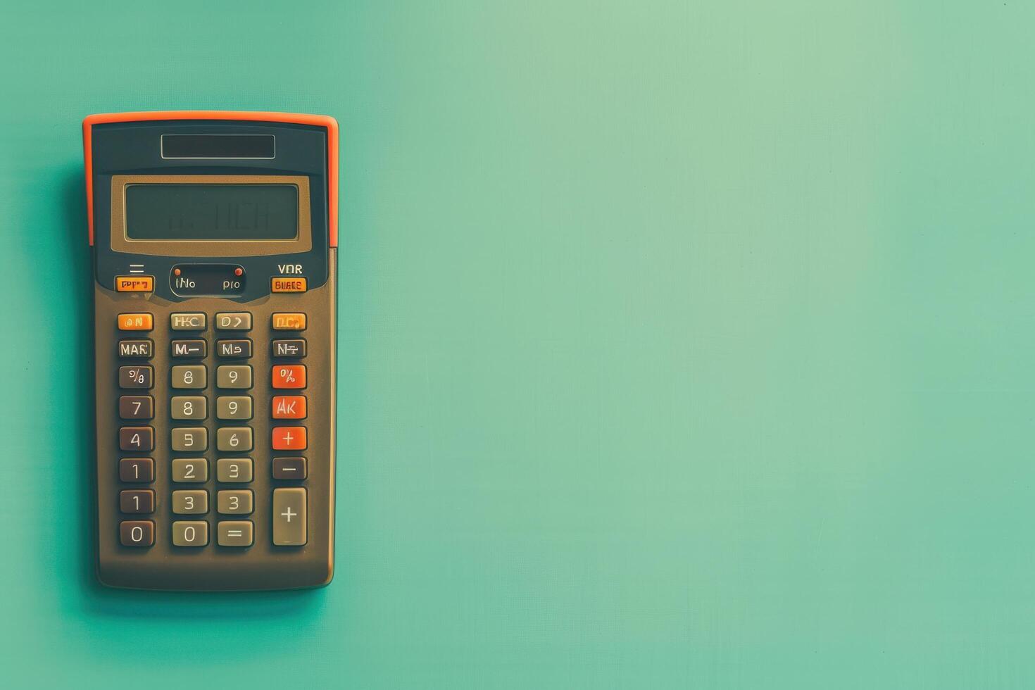 A vintage calculator rests on a pastel green table, evoking nostalgia and simplicity in everyday math tasks photo