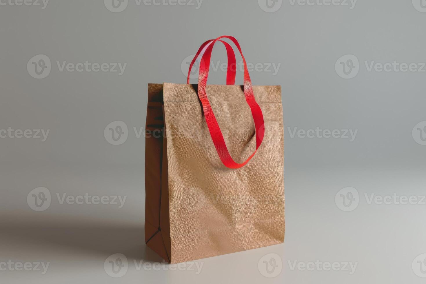 Simple brown paper bag with red handles on a neutral background photo