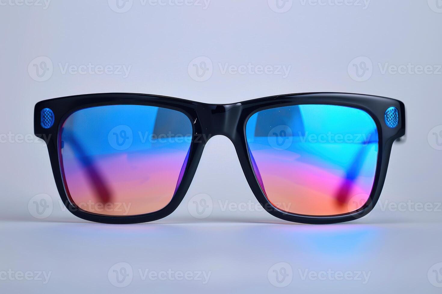 Stylish sunglasses with blue and pink reflective lenses against a light background photo