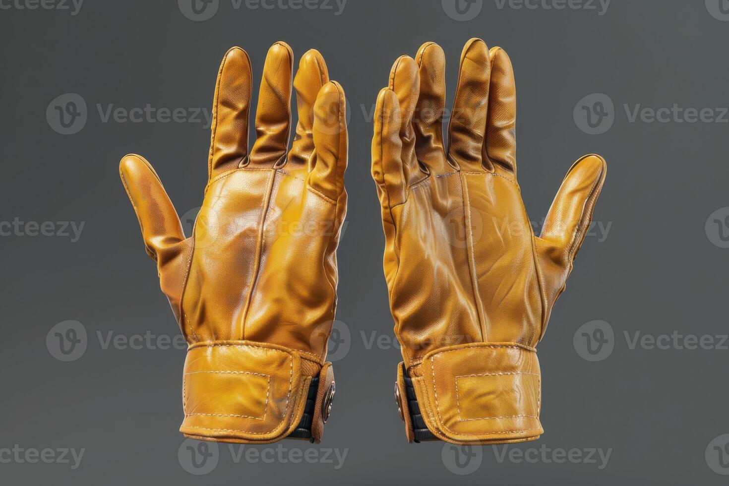 Brown leather gloves displayed against a neutral gray background showcasing their texture and design photo