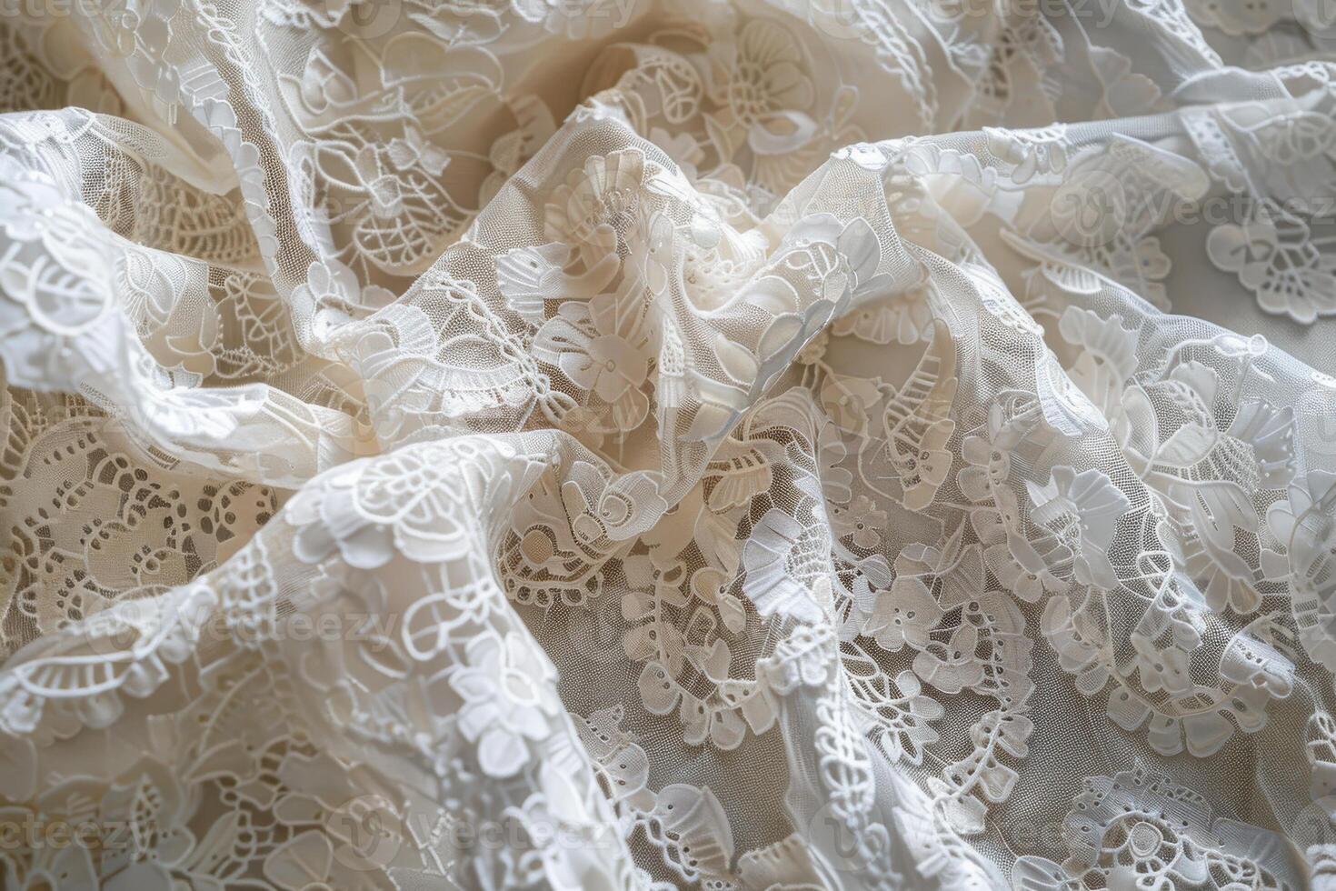 Delicate cream lace fabric draped elegantly on a soft background photo