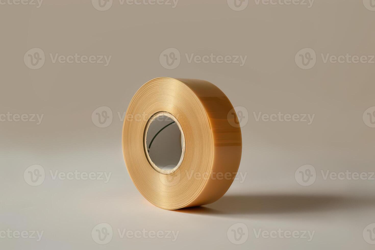 Clear adhesive tape roll with a neutral background, ideal for crafts and repairs photo