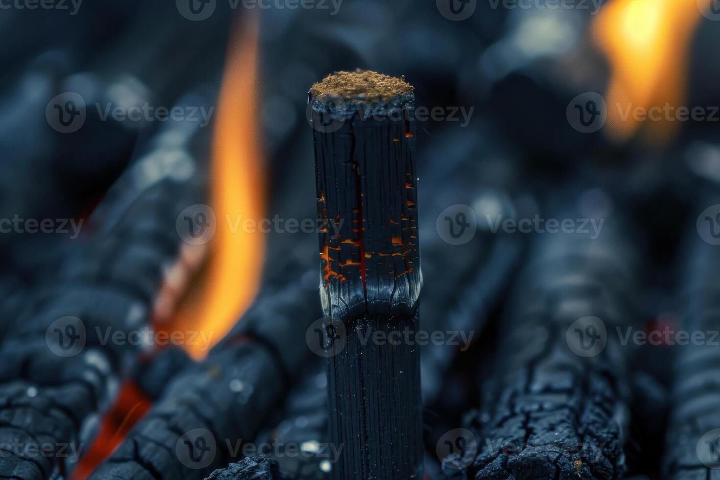 Charcoal burning with glowing embers in a barbecue grill during the evening hours photo