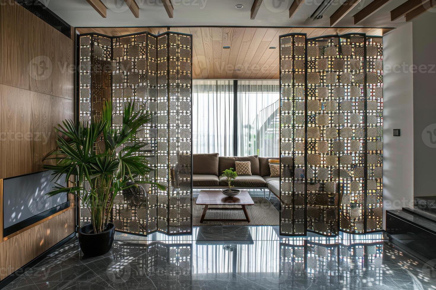 Modern living room with stylish partitions and a green plant in a contemporary home photo