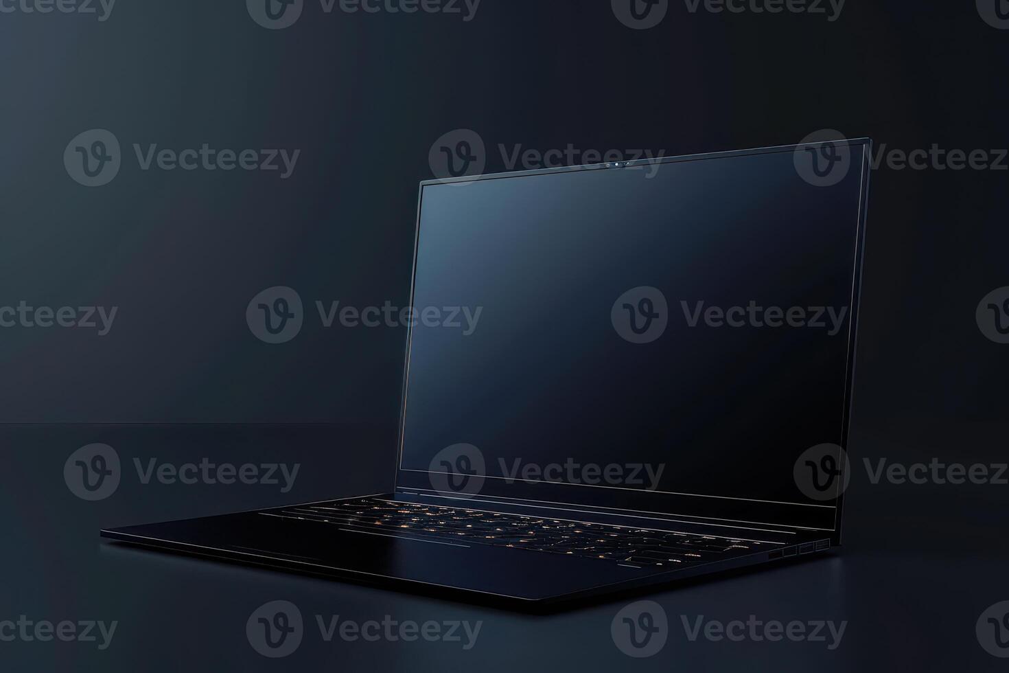 Sleek black laptop positioned on a dark surface, illuminated by soft ambient light in a modern workspace photo