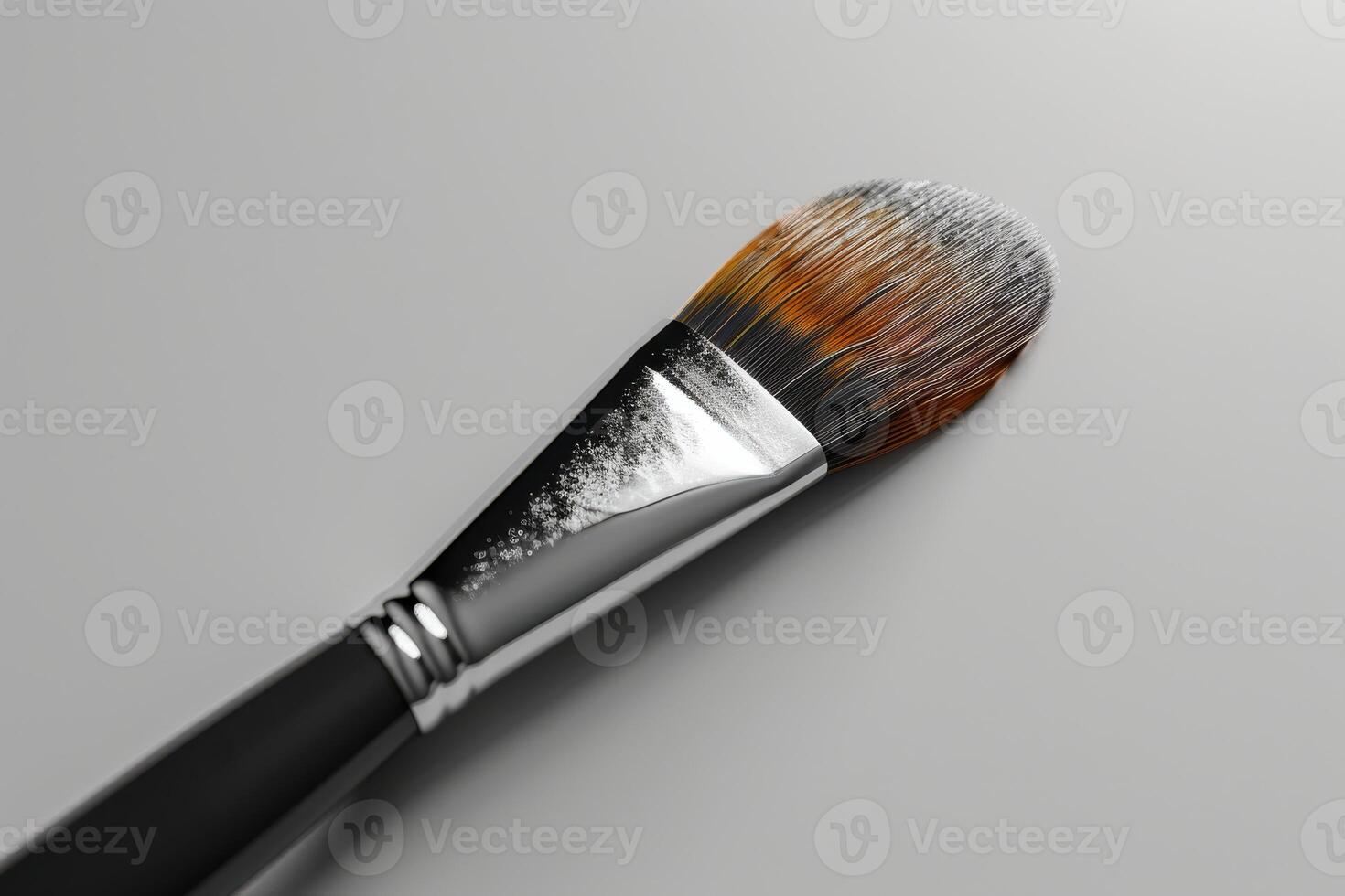 Close-up of a makeup brush displaying vibrant bristles and subtle color variations on a smooth surface photo