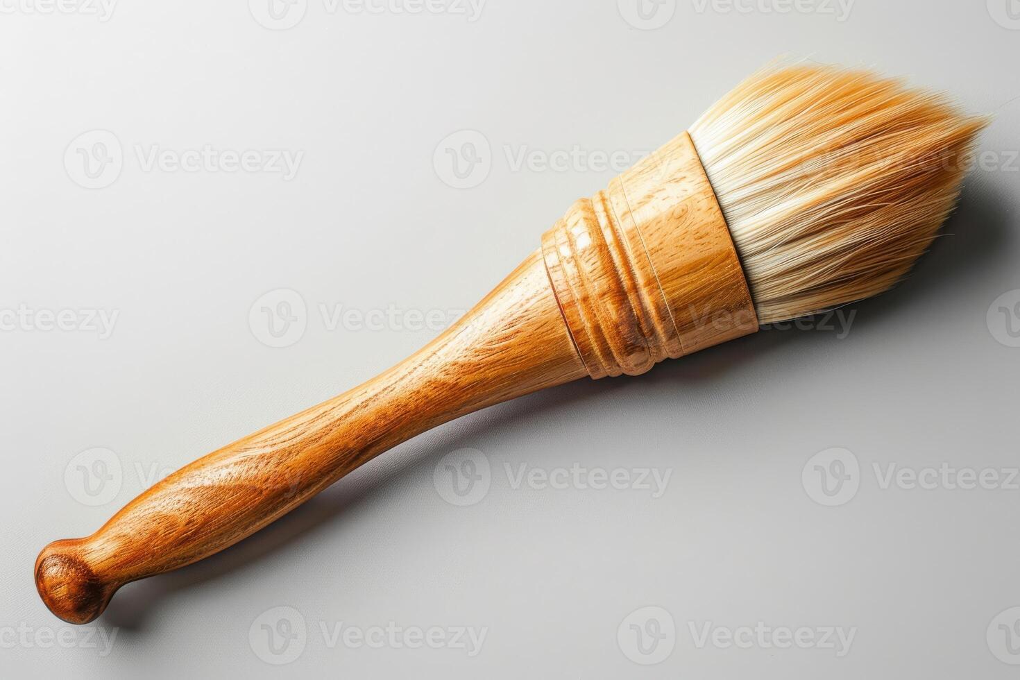 Wooden handle brush with soft bristles on a neutral background photo
