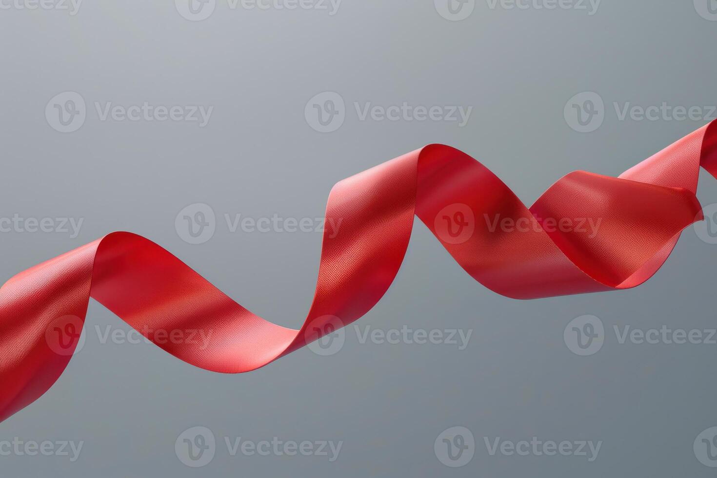 Red ribbon swaying gracefully against a neutral backdrop photo