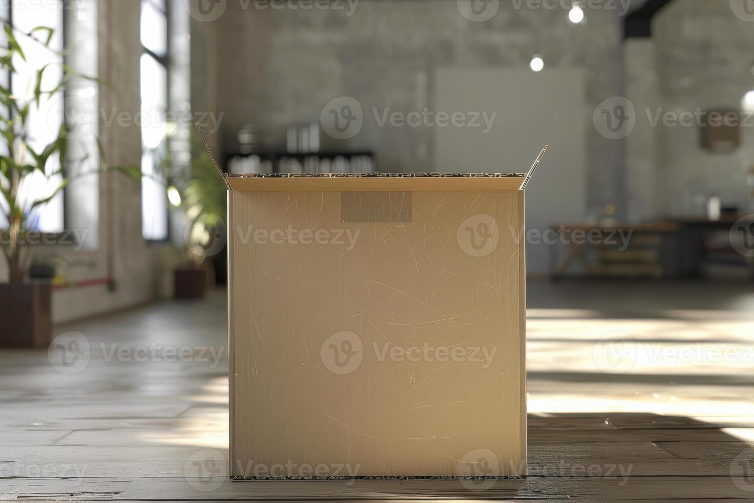 An empty cardboard box in a modern, sunlit loft workspace during the day photo