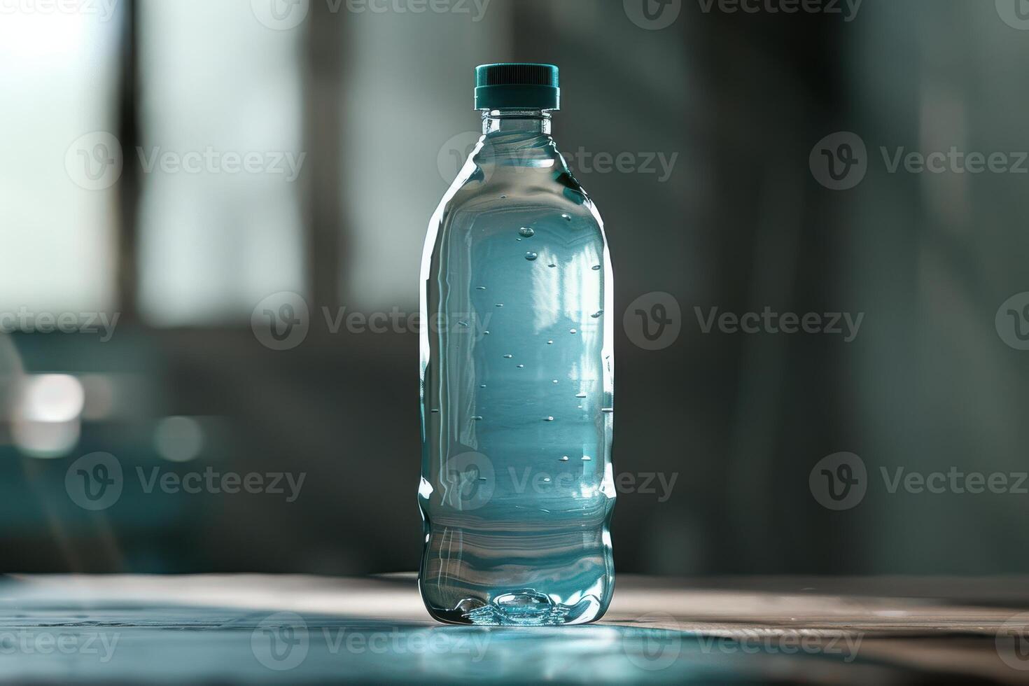 Clear plastic water bottle on wooden surface with sunlight streaming through window photo