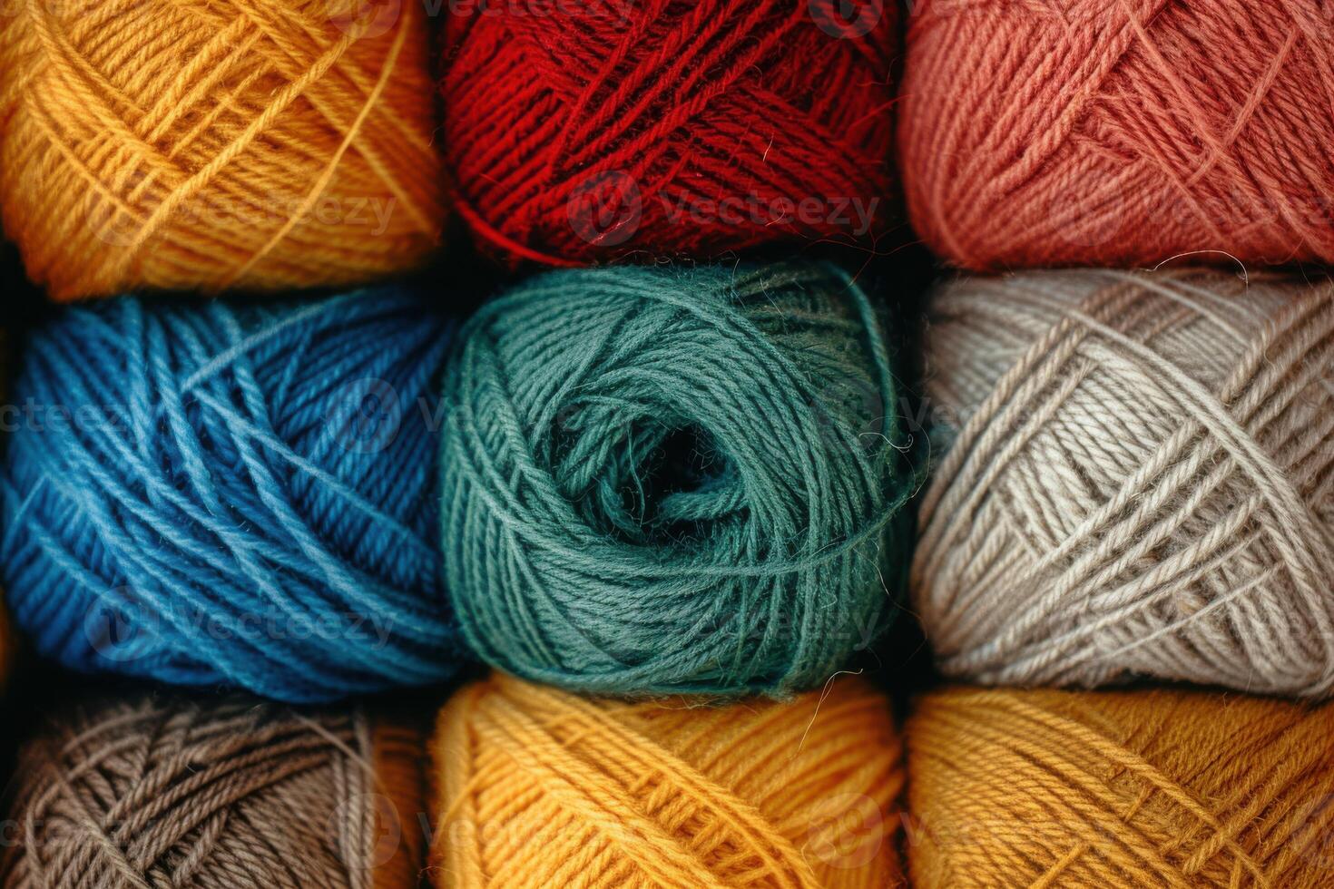 Colorful yarn balls arranged in a grid pattern, showcasing various textures and hues photo