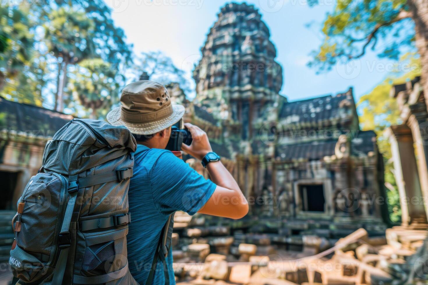 Exploring ancient temples in Cambodia with a camera during a sunny day in the jungle photo