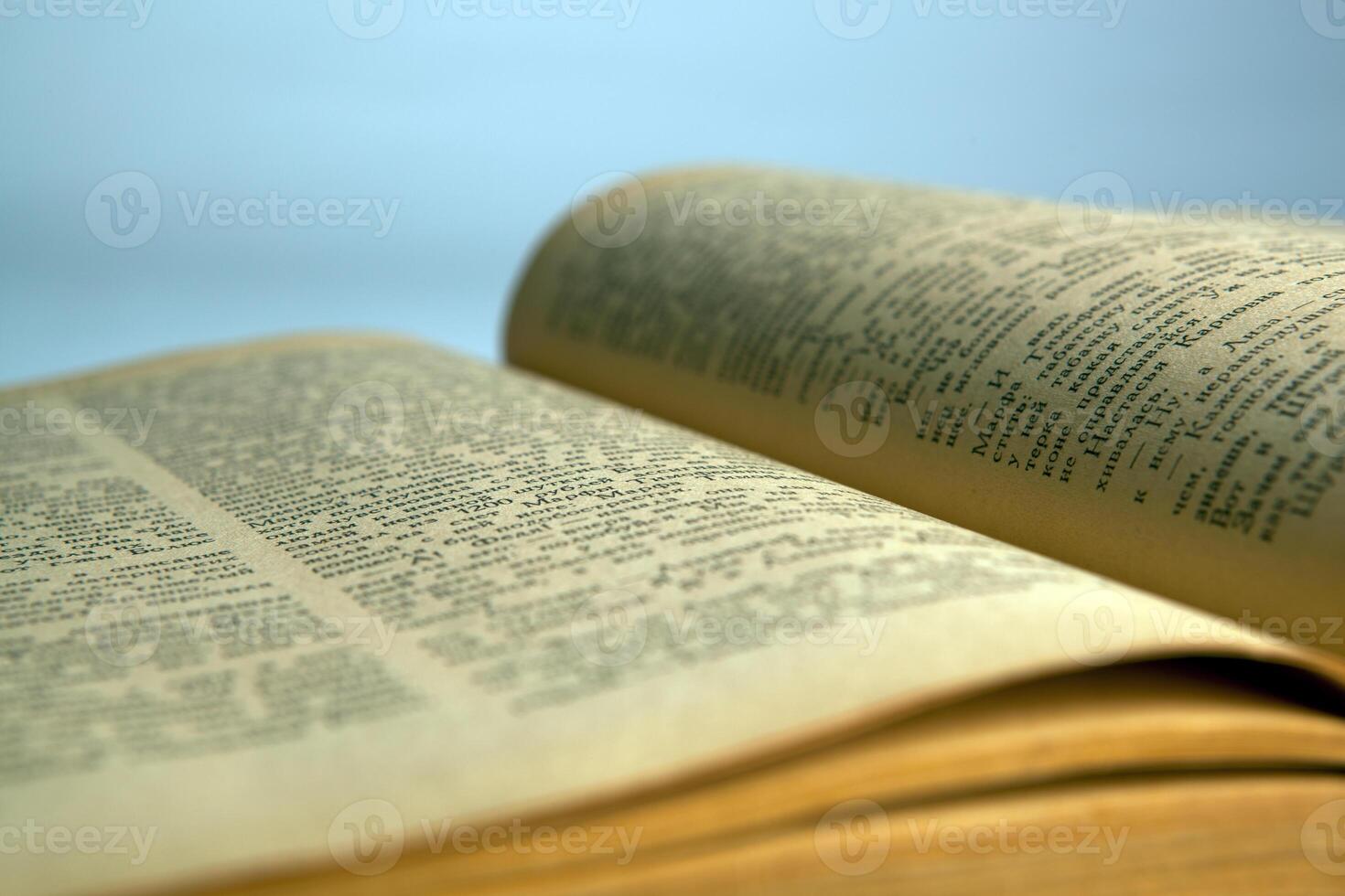Open old book text close-up photo