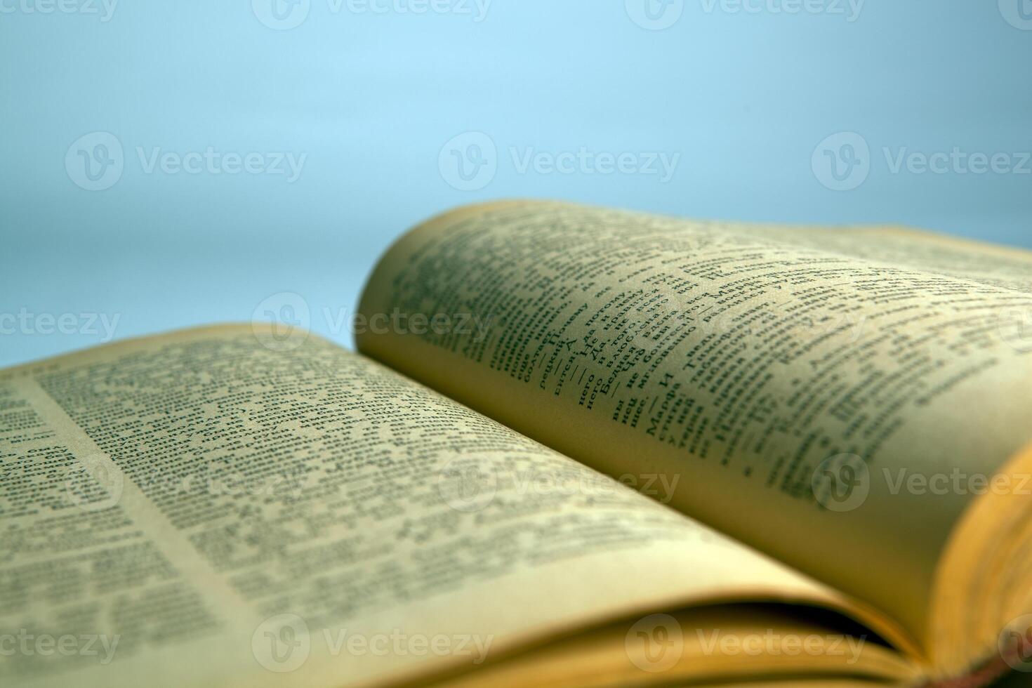 Open old book text close-up photo