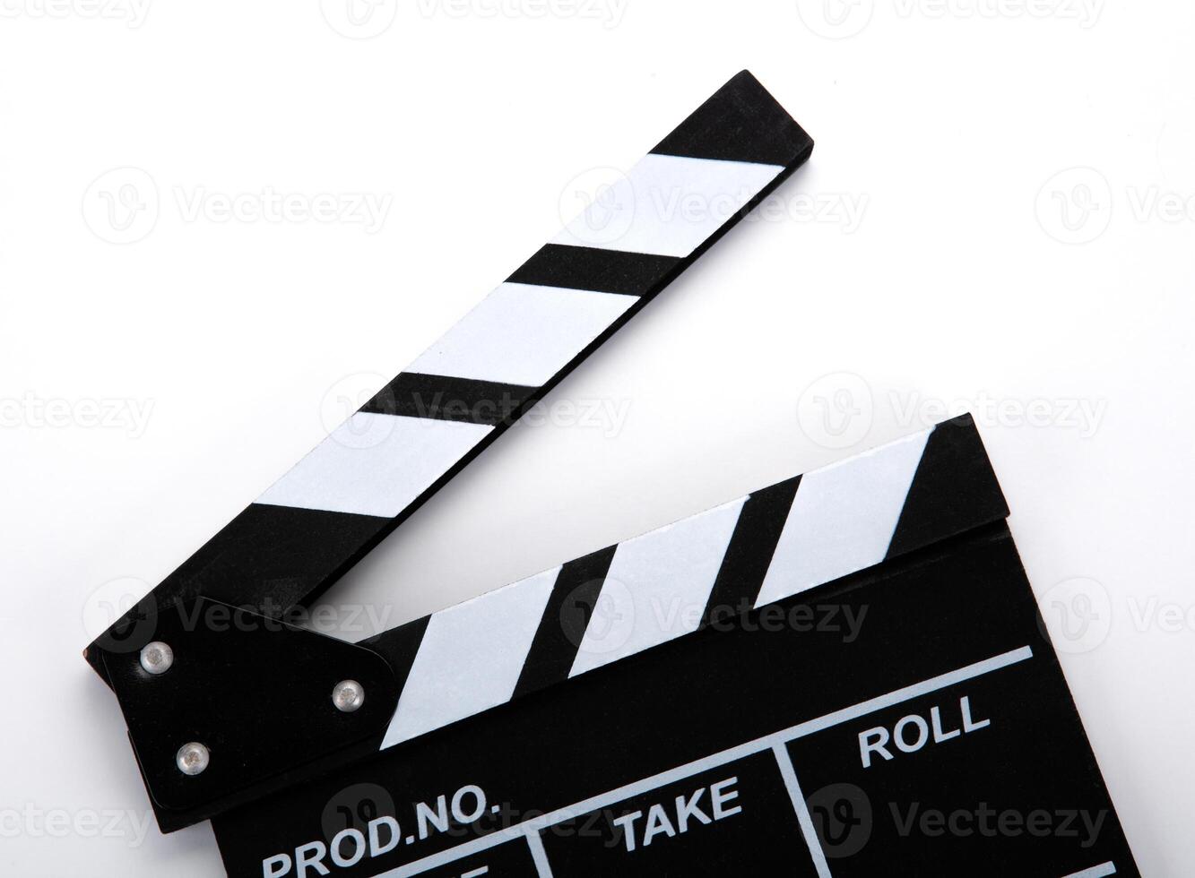 black movie clapper with white inscriptions on a white table photo
