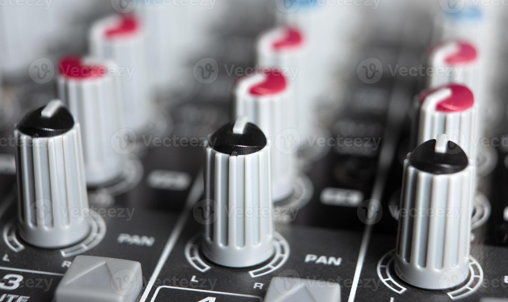 sound mixer and faders close up music studio photo