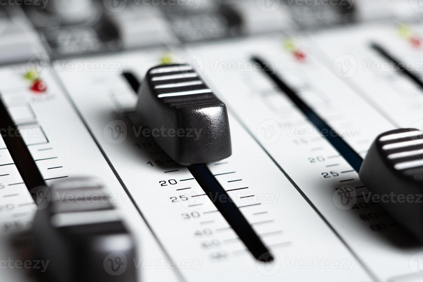 sound mixer and faders close up music studio photo