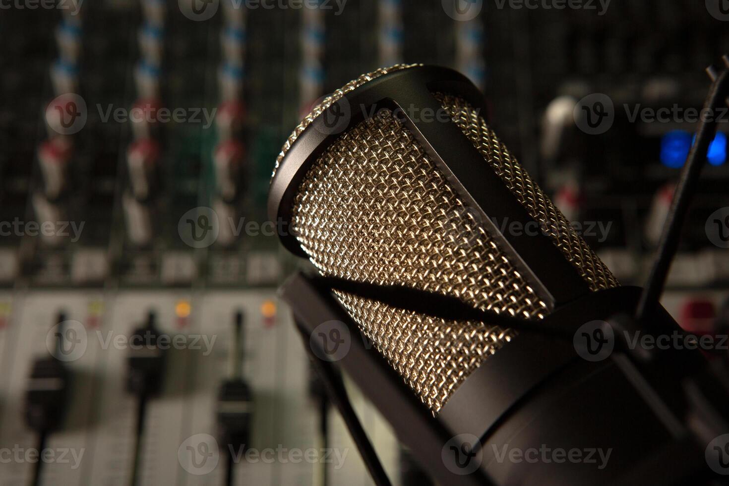 sound mixer and faders with condenser microphone DJ disco photo