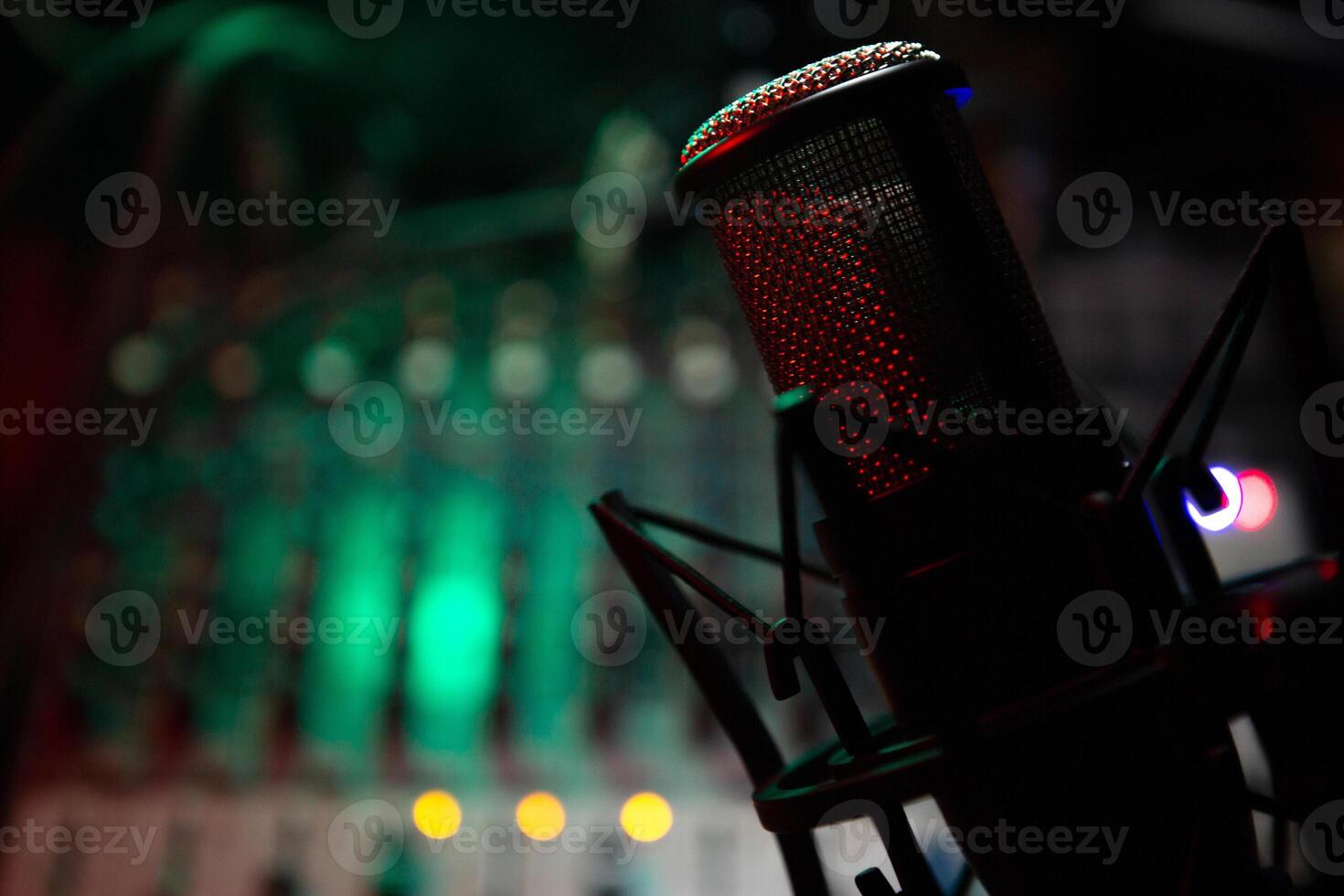sound mixer and faders with condenser microphone DJ disco photo